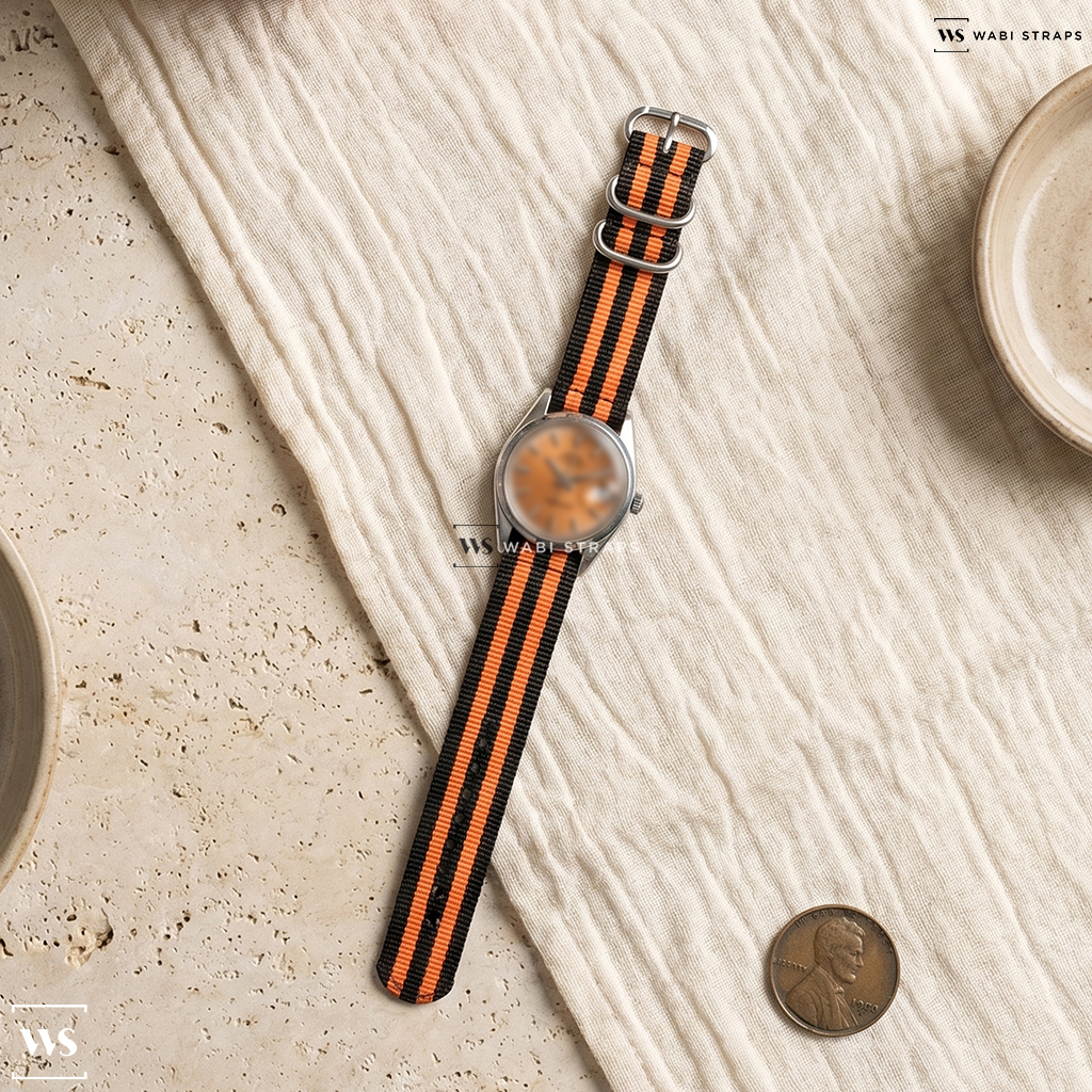Black/Orange 5 Stripes Nylon Watch Strap on Universal Geneve Polerouter Date Microrotor Patina Tropical Dial